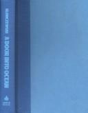 Cover of an early paperback edition of A Door Into Ocean by Joan Slonczewski, a plain blue background with the title stacked in large white serif type above a small starfield motif.